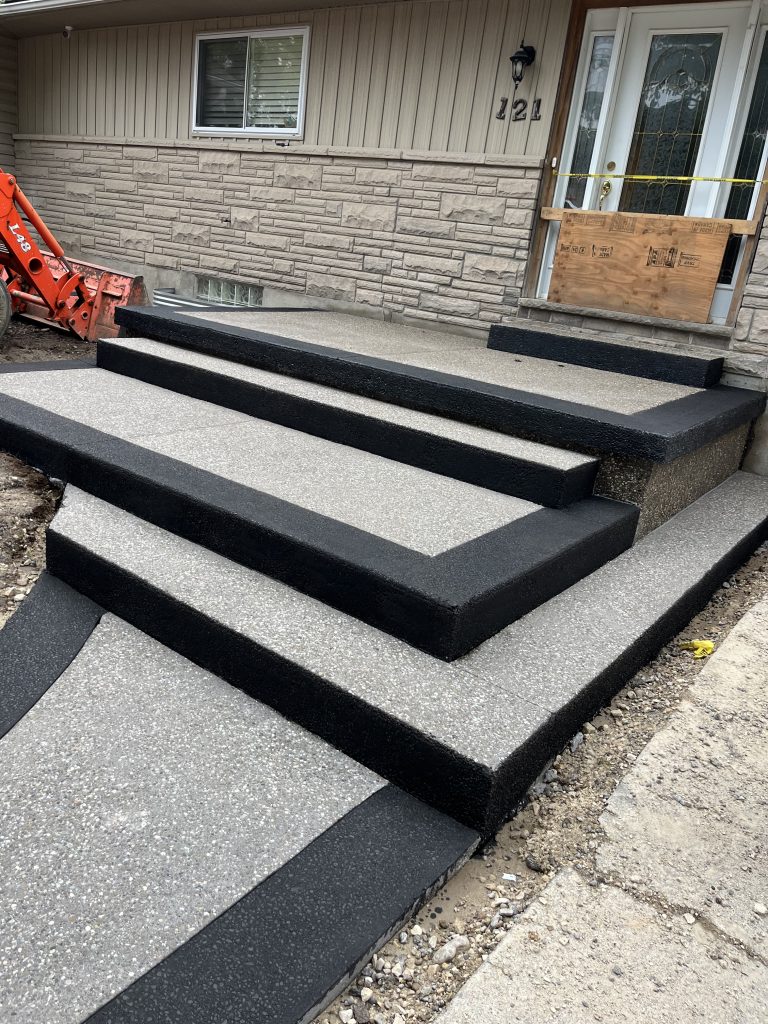 IMG_1261-768x1024 BK Concrete Inc. finished exposed aggregate steps with black border in Guelph residential entryway